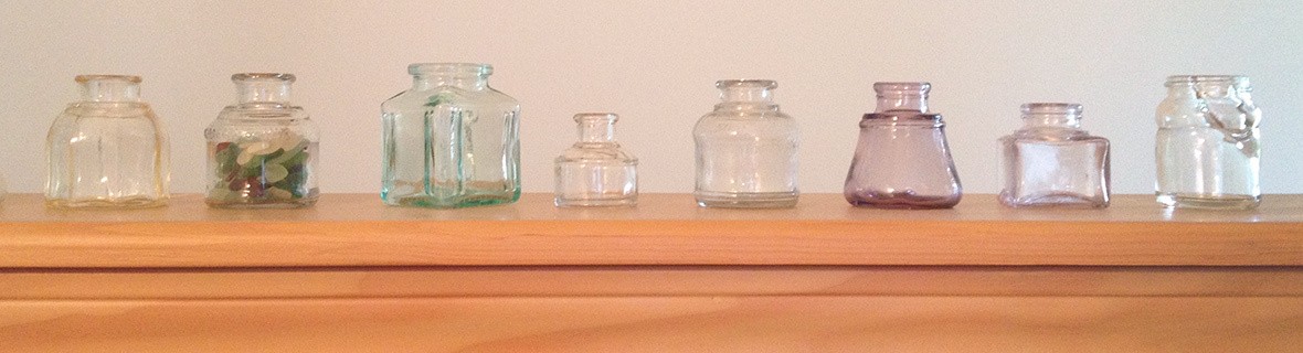 Glass antique ink wells woned by Sue Becker Grapher